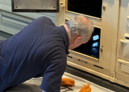 Vyv-Jenking-busy-at-work-cleaning-the-oven