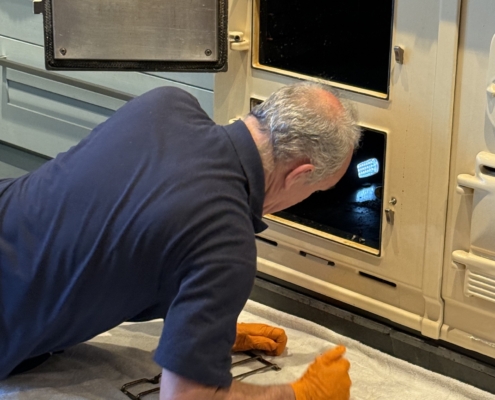 Vyv-Jenking-busy-at-work-cleaning-the-oven